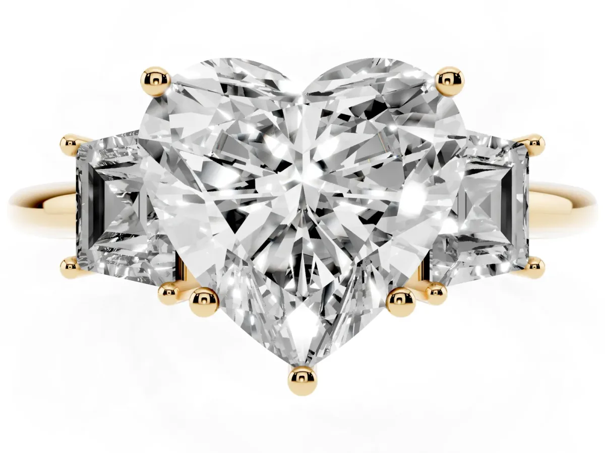 Heart Cut Diamond Three-Stone Ring with Trapezoid Side Stones and Prong Setting Yellow gold