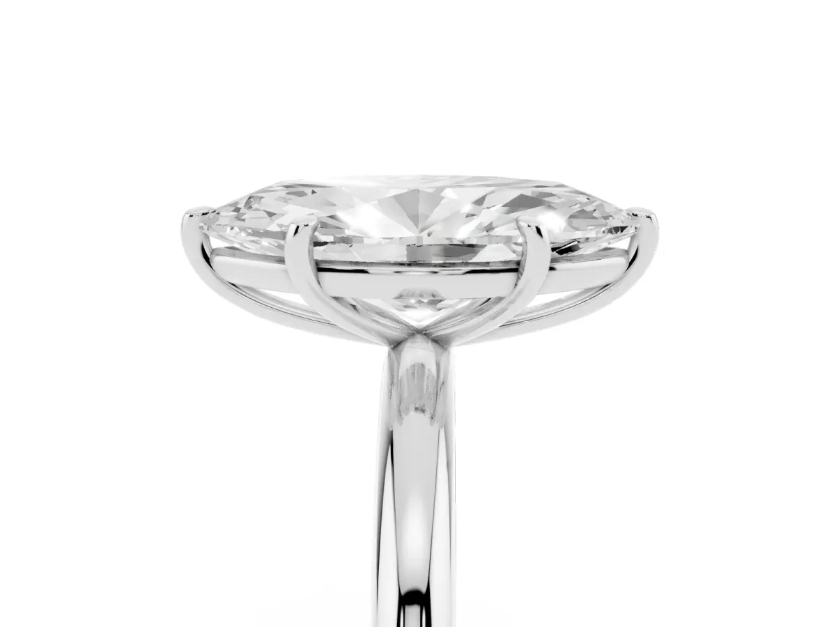 Oval Cut Solitaire Diamond Ring with Four-Prong Setting on a Plain Band Platinum