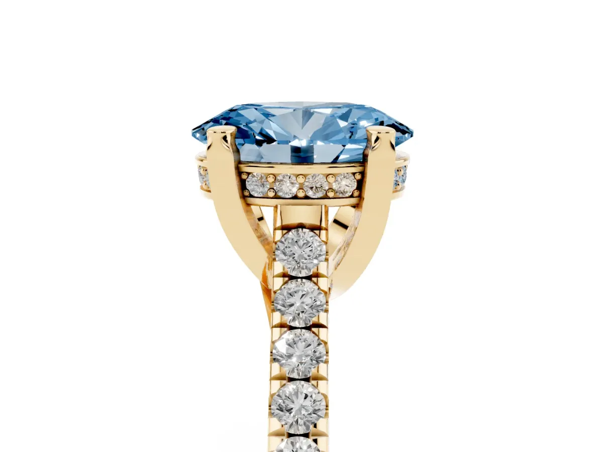 Fancy Blue Oval Cut Brilliant Diamond Solitaire with Pavé Band and Four-Prong Setting Yellow gold