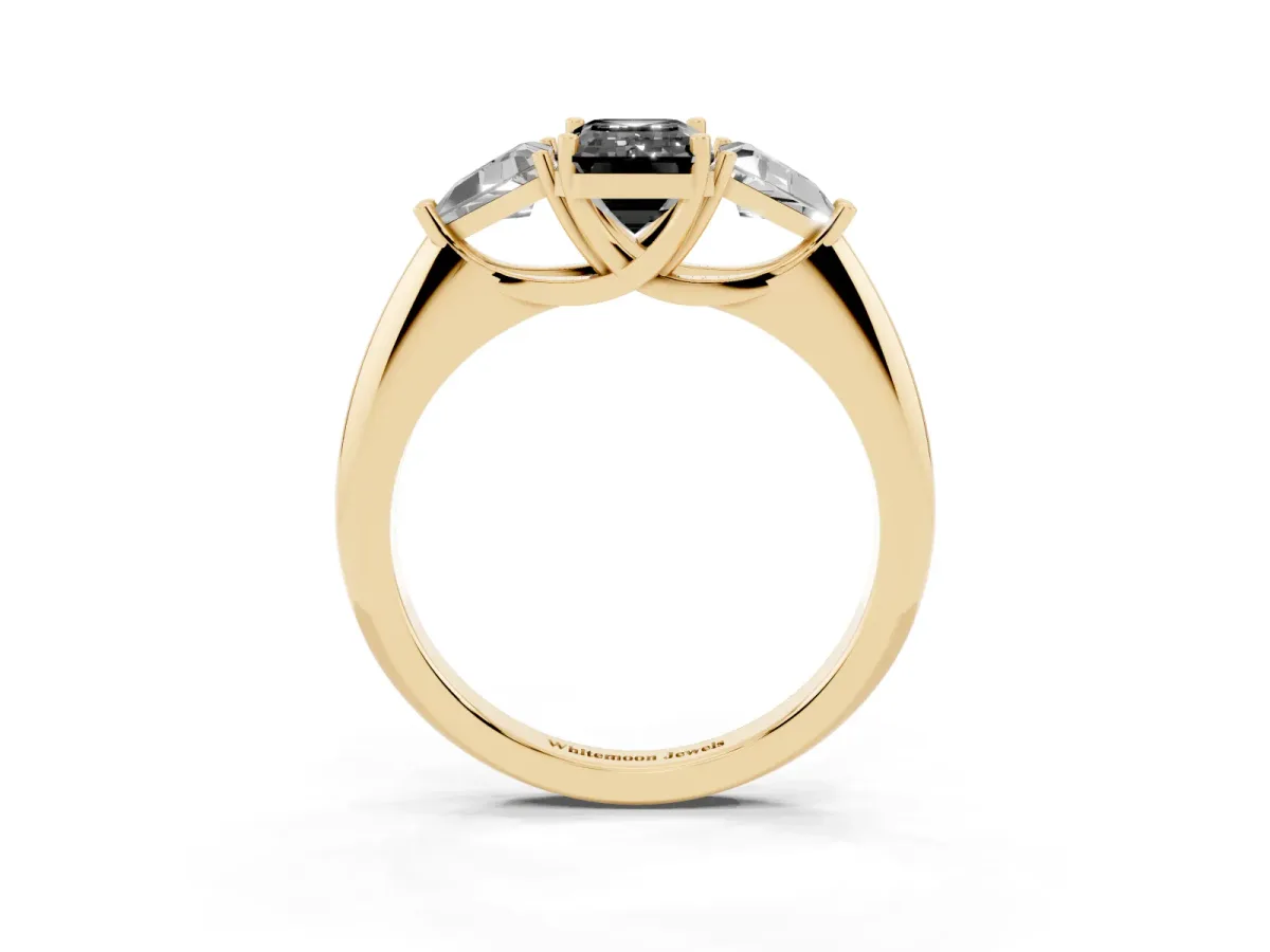 Fancy Black Three-Stone Emerald Cut Diamond Engagement Ring with Trillion Side Stones and Prong Setting Yellow gold