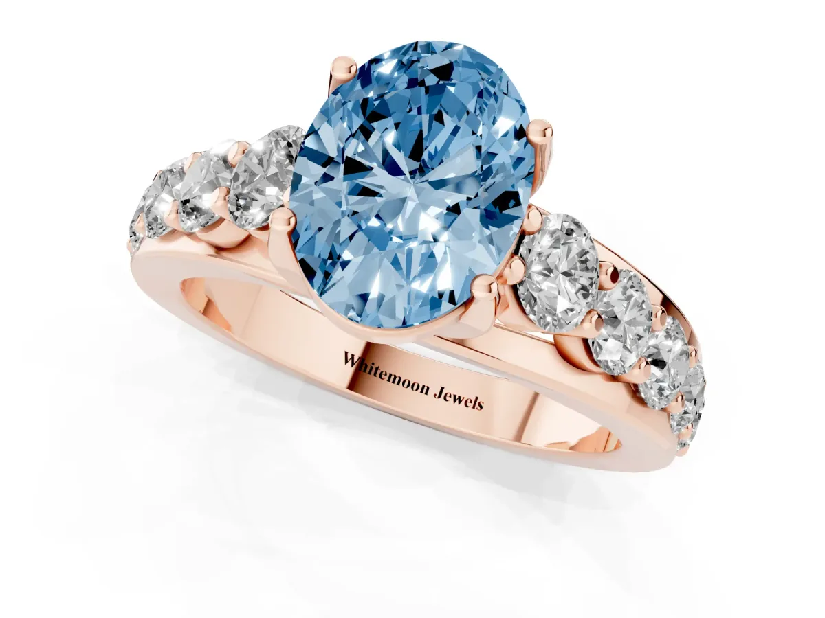 Fancy Blue Oval Cut Diamond Engagement Ring with Pavé Band and Four-Prong Setting Rose gold