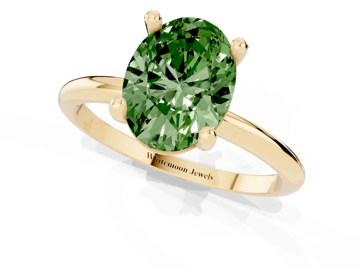 Fancy Green Oval Cut Solitaire Diamond Ring with 4-Prong Setting on a Classic Band Yellow gold