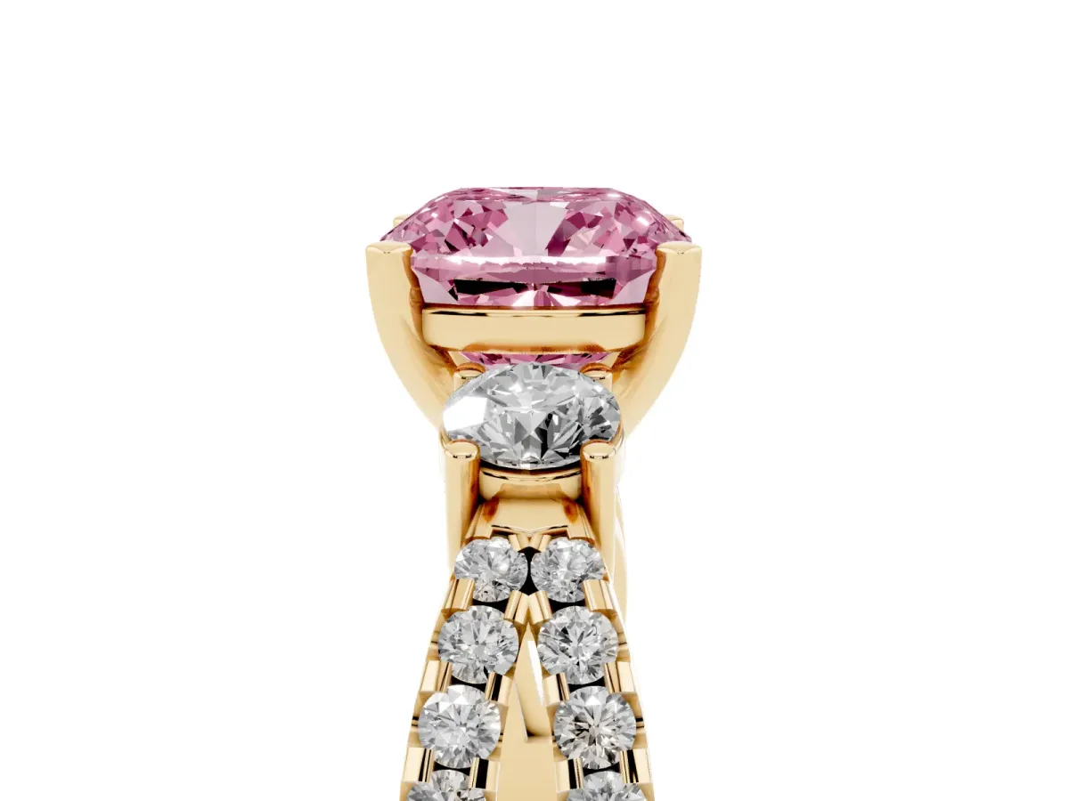 Fancy Pink Cushion Cut Diamond Three-Stone Ring with Pavé Split Shank and Four-Prong Setting Yellow gold