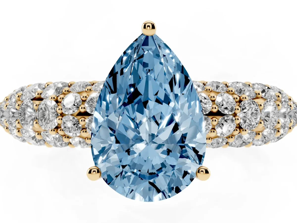 Fancy Blue Pear Cut Diamond Pavé Band Solitaire Ring with Four-Prong Setting Yellow gold