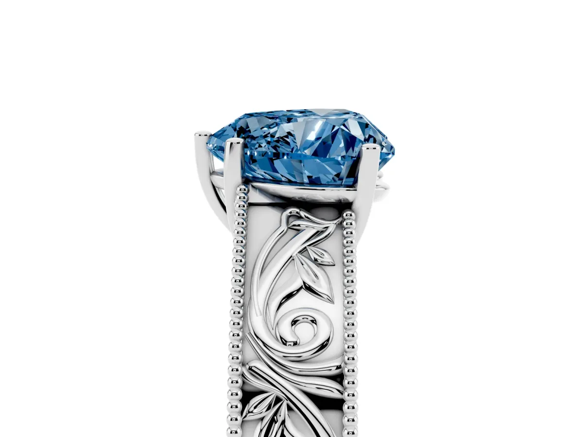 Fancy Blue Heart Cut Diamond Solitaire Ring with Engraved Band and Four-Prong Setting Silver