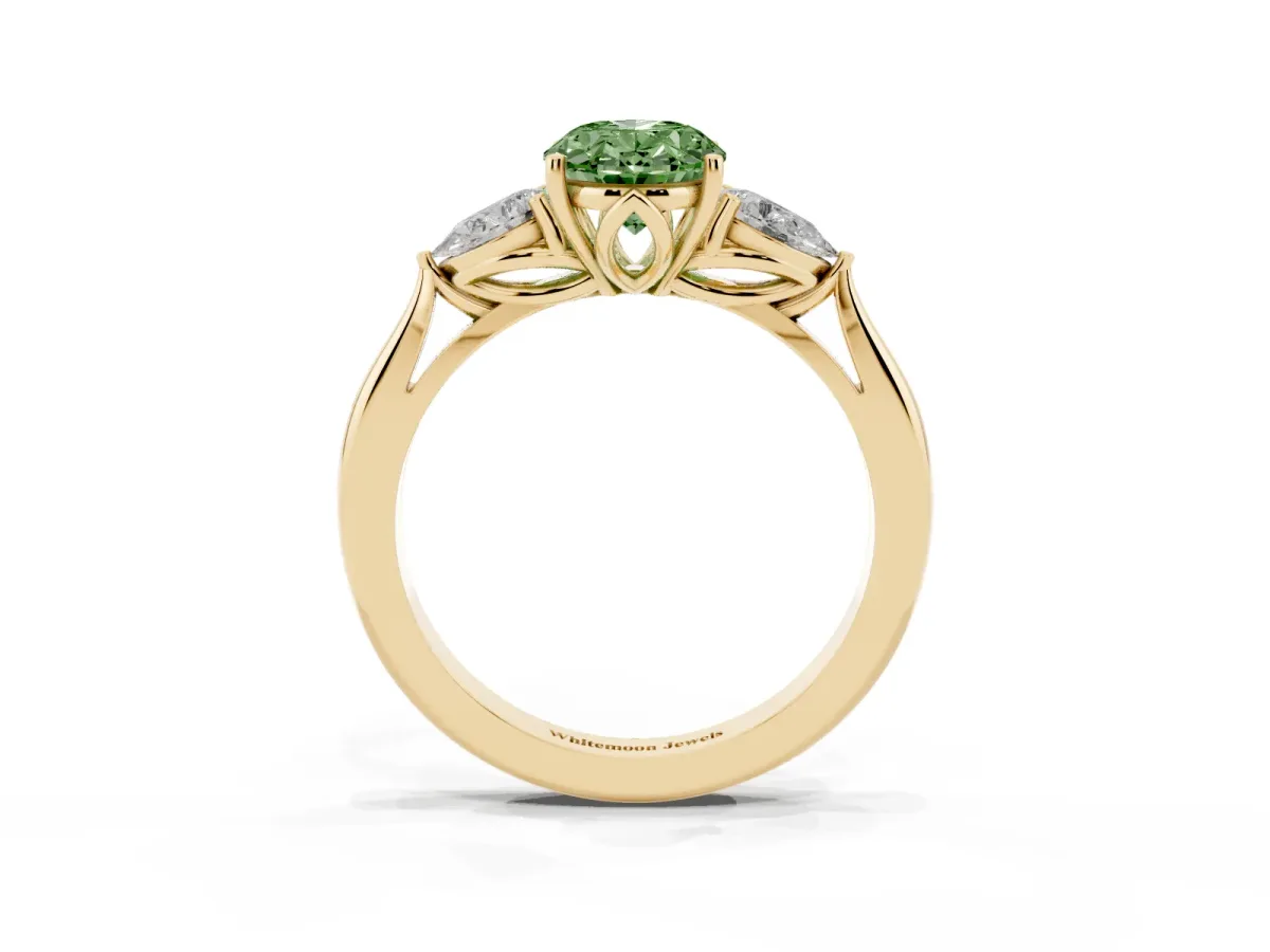 Fancy Green Three-Stone Oval Cut Diamond Ring with Pear Side Stones in Four-Prong Setting Yellow gold