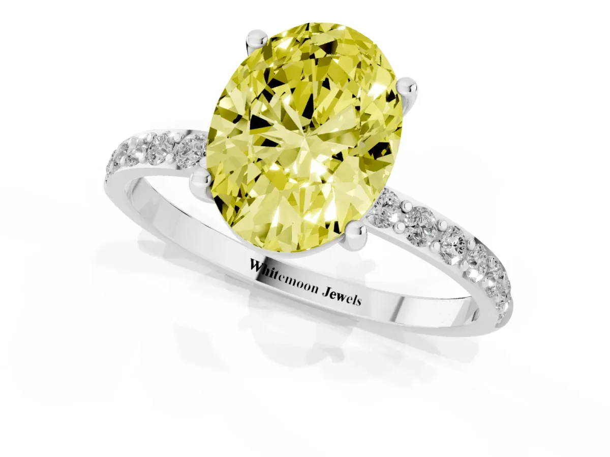 Fancy Yellow Oval Cut Diamond Solitaire Ring with Round Pavé Shoulders and Prong Setting Silver