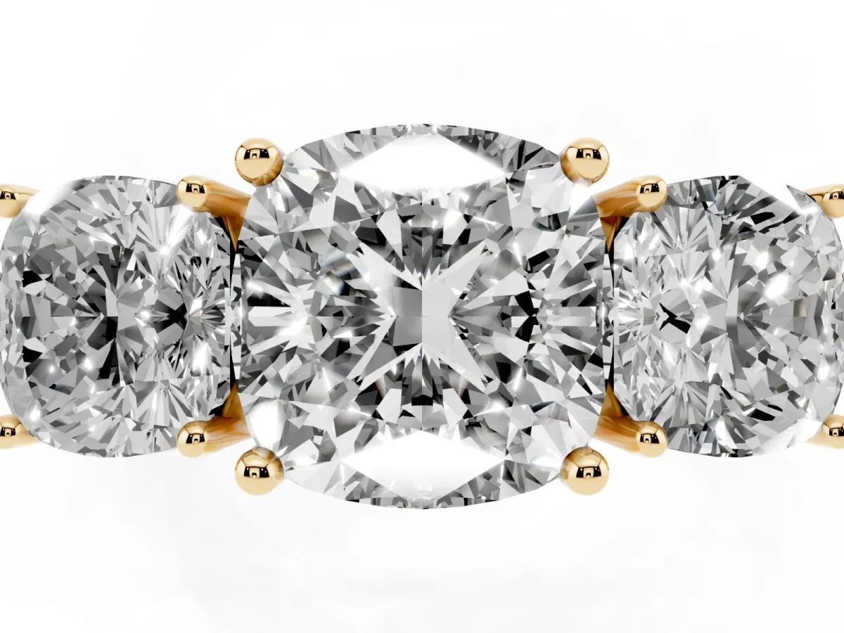 Three-Stone Cushion Cut Cut Diamond Engagement Ring with Prong Setting on a White Gold Band Yellow gold
