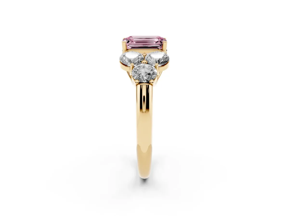 Fancy Pink Emerald Cut Cut Diamond Cluster Ring with Round Accent Stones and Prong Setting on a Classic Band Yellow gold
