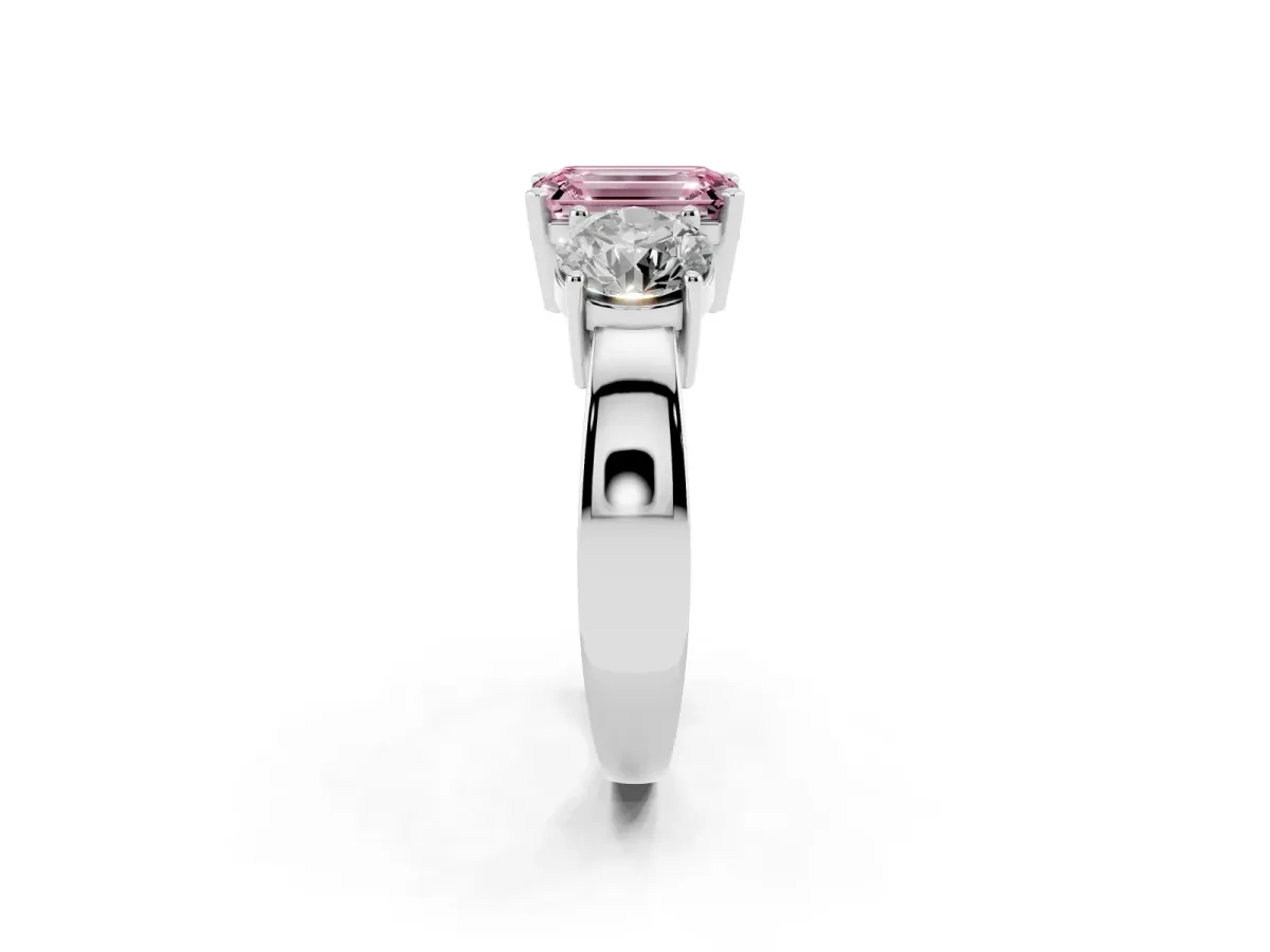 Fancy Pink Three-Stone Emerald Cut Diamond Ring with Round Side Stones, Classic Band, and Four-Prong Setting Silver