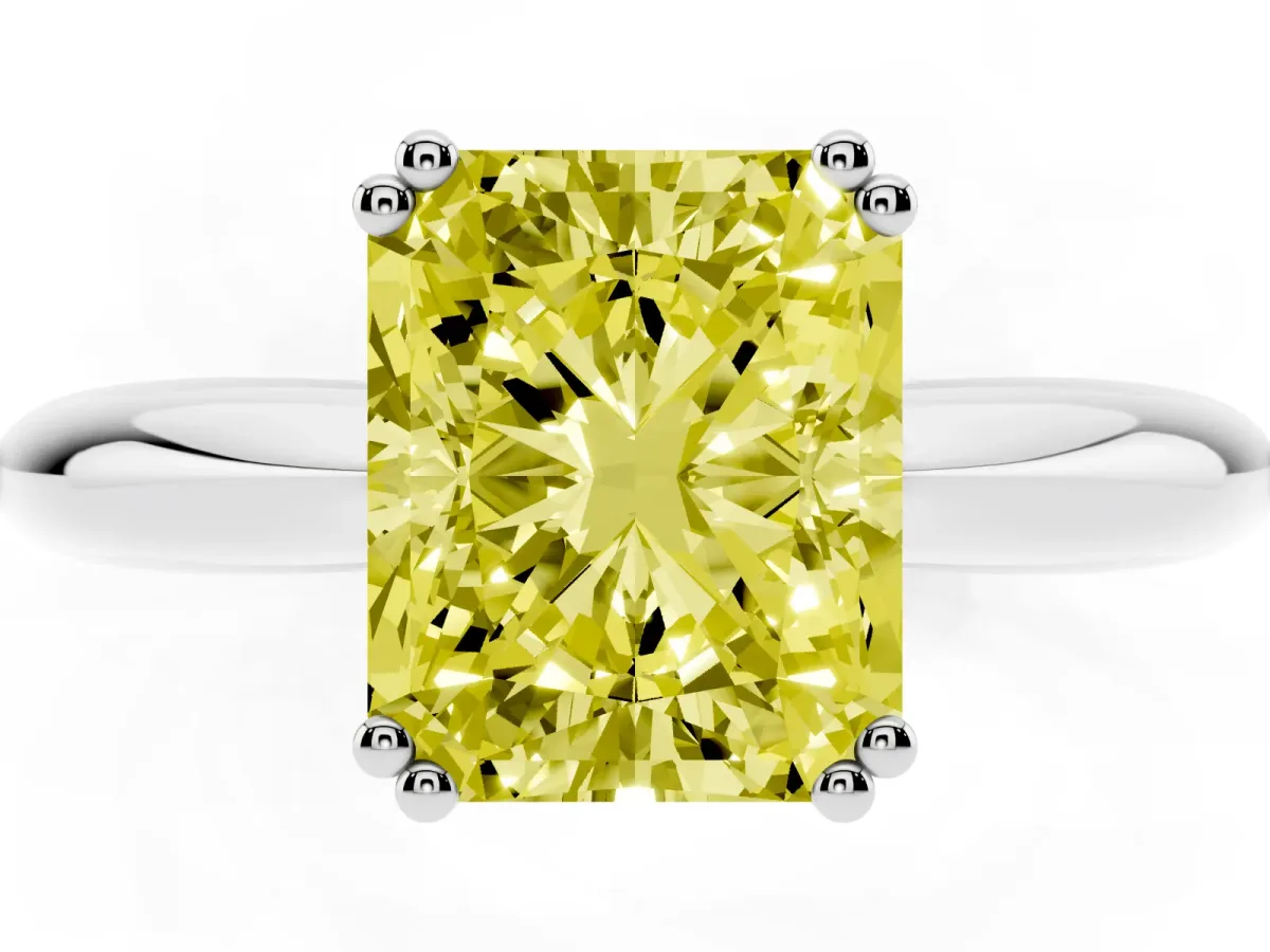 Fancy Yellow Radiant Cut Cut Solitaire Engagement Ring with Tapered Band and Four-Prong Setting White gold