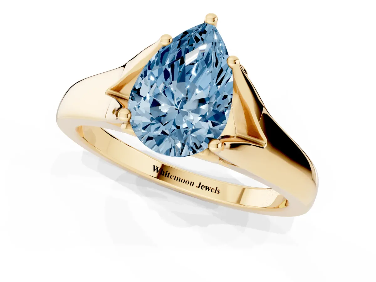 Fancy Blue Pear Cut Solitaire Diamond Ring with Cathedral Band and Four-Prong Setting Yellow gold