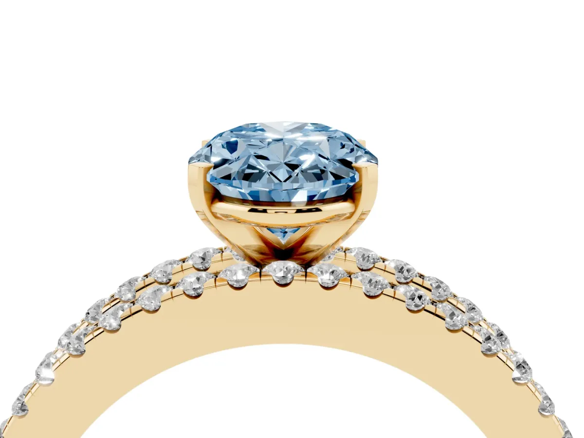 Fancy Blue Oval Cut Diamond Solitaire Ring with Pavé and Channel Set Band Yellow gold