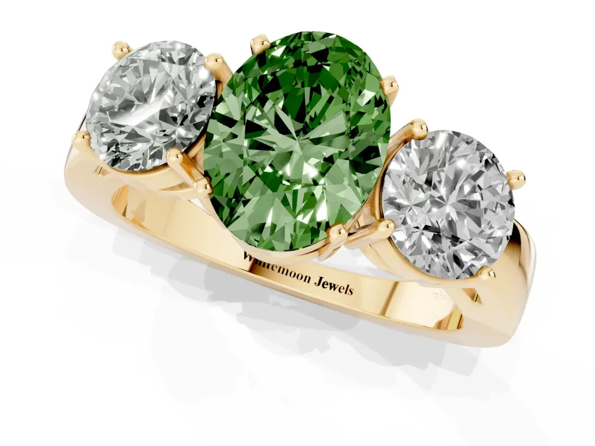 Fancy Green Three-Stone Oval Cut Diamond Ring with Round Side Stones, Classic Band, and Four-Prong Setting Yellow gold