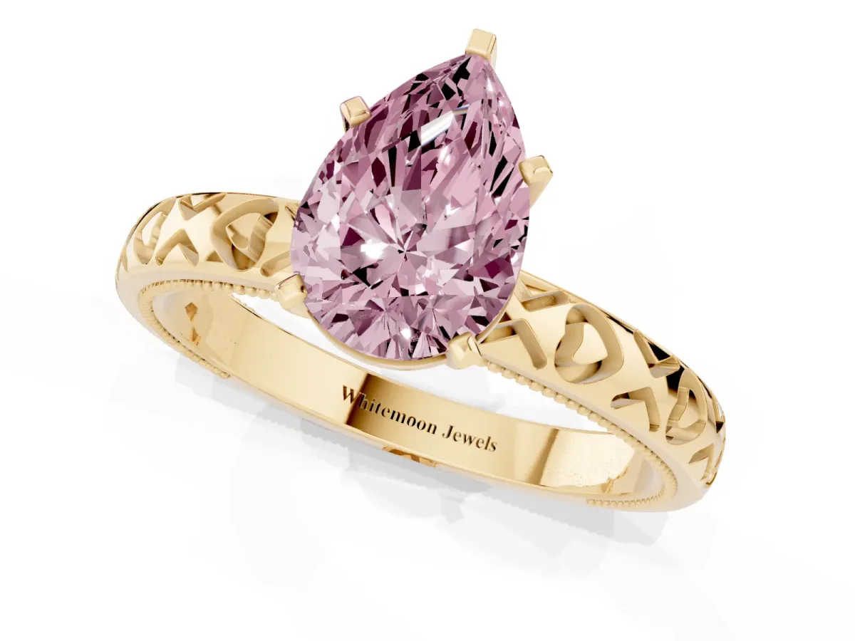 Fancy Pink Pear Cut Solitaire Diamond Engagement Ring with XO Engraved Band and Four-Prong Setting Yellow gold