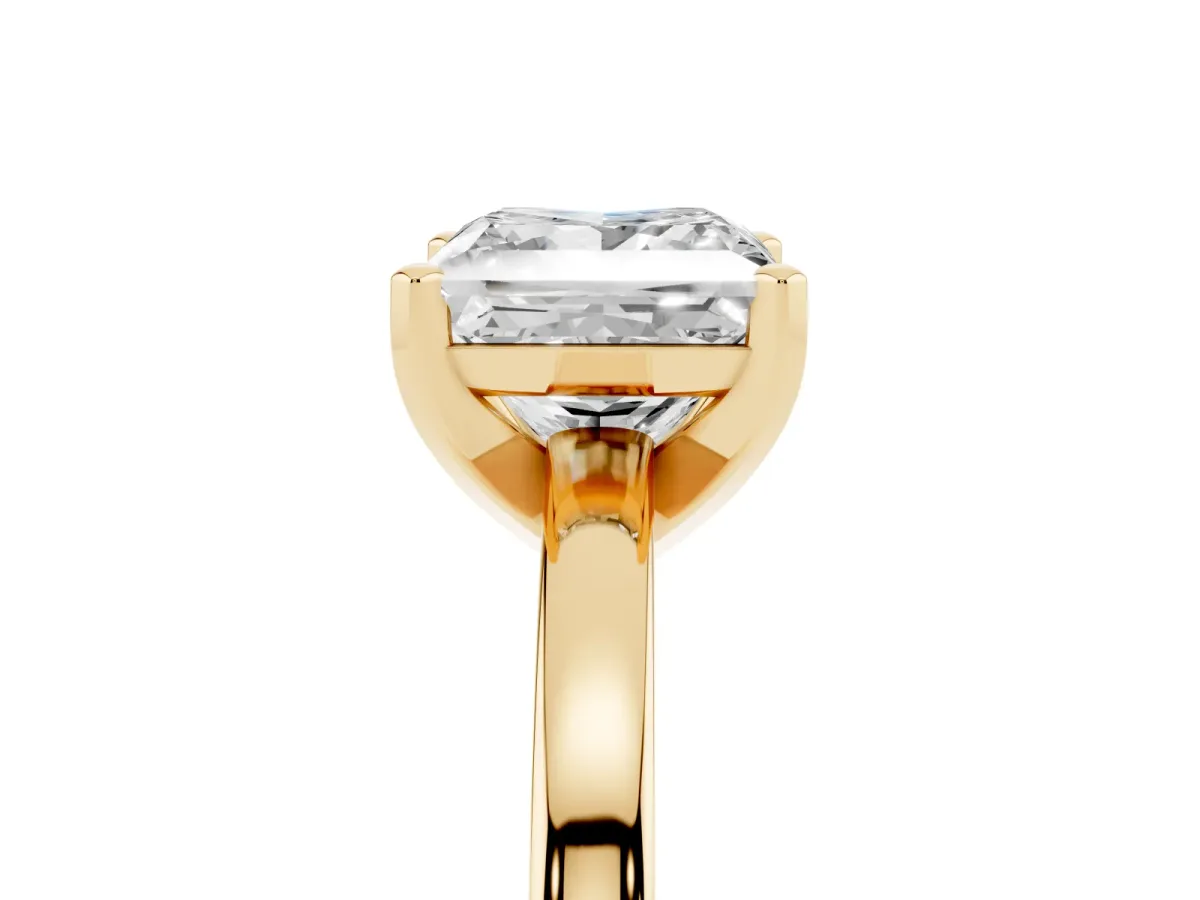 Princess Cut Solitaire Diamond Engagement Ring with Four-Prong Setting on a Classic Band Yellow gold