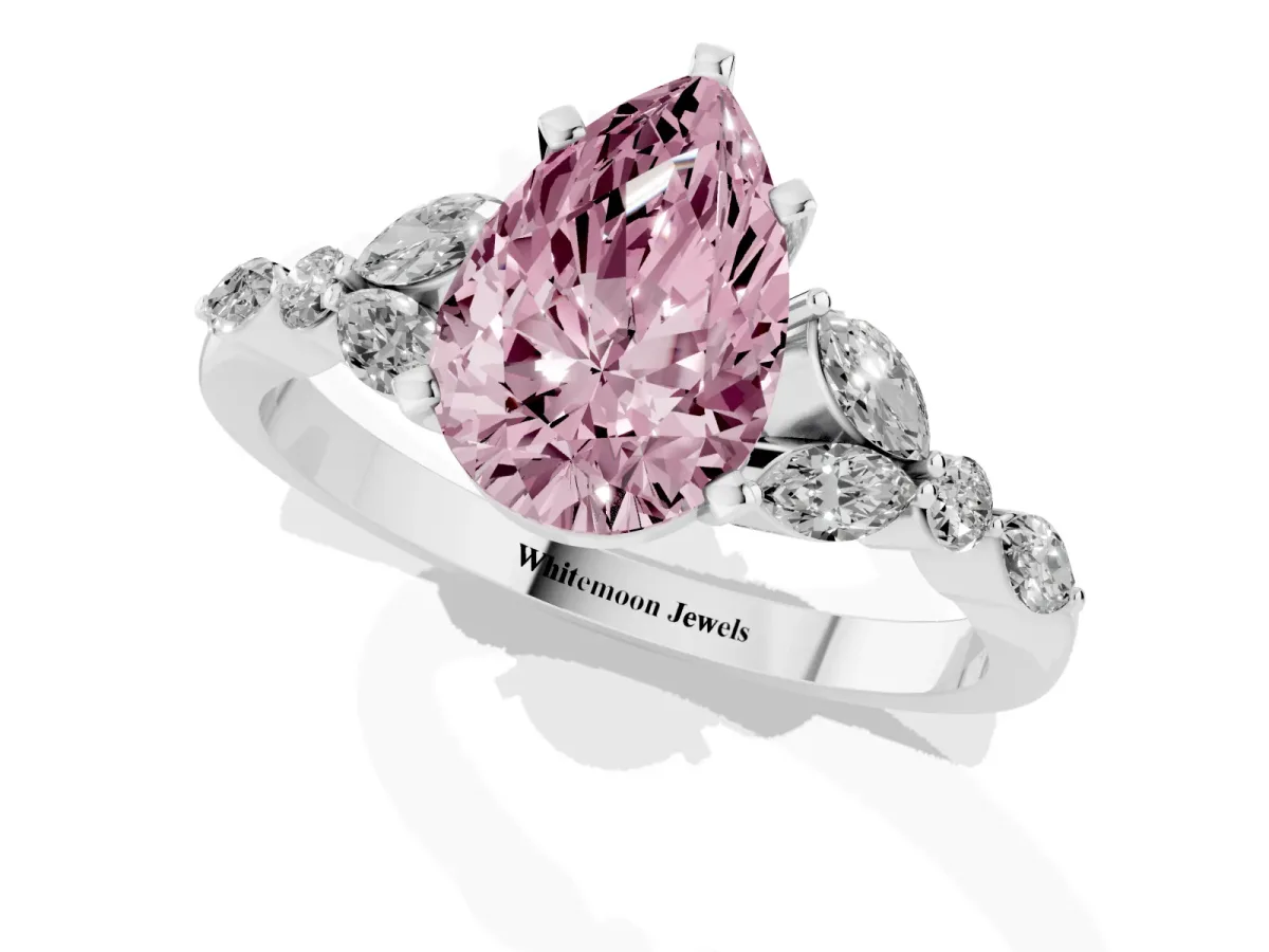Fancy Pink Pear Cut Diamond Solitaire Ring with Side Stones and Four-Prong Setting Platinum