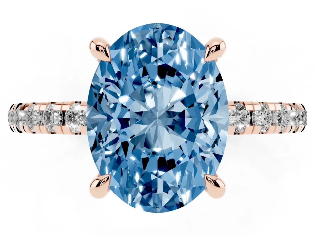 Fancy Blue Oval Cut Diamond Brilliant Solitaire Ring with Pavé Band and Four-Prong Setting Rose gold