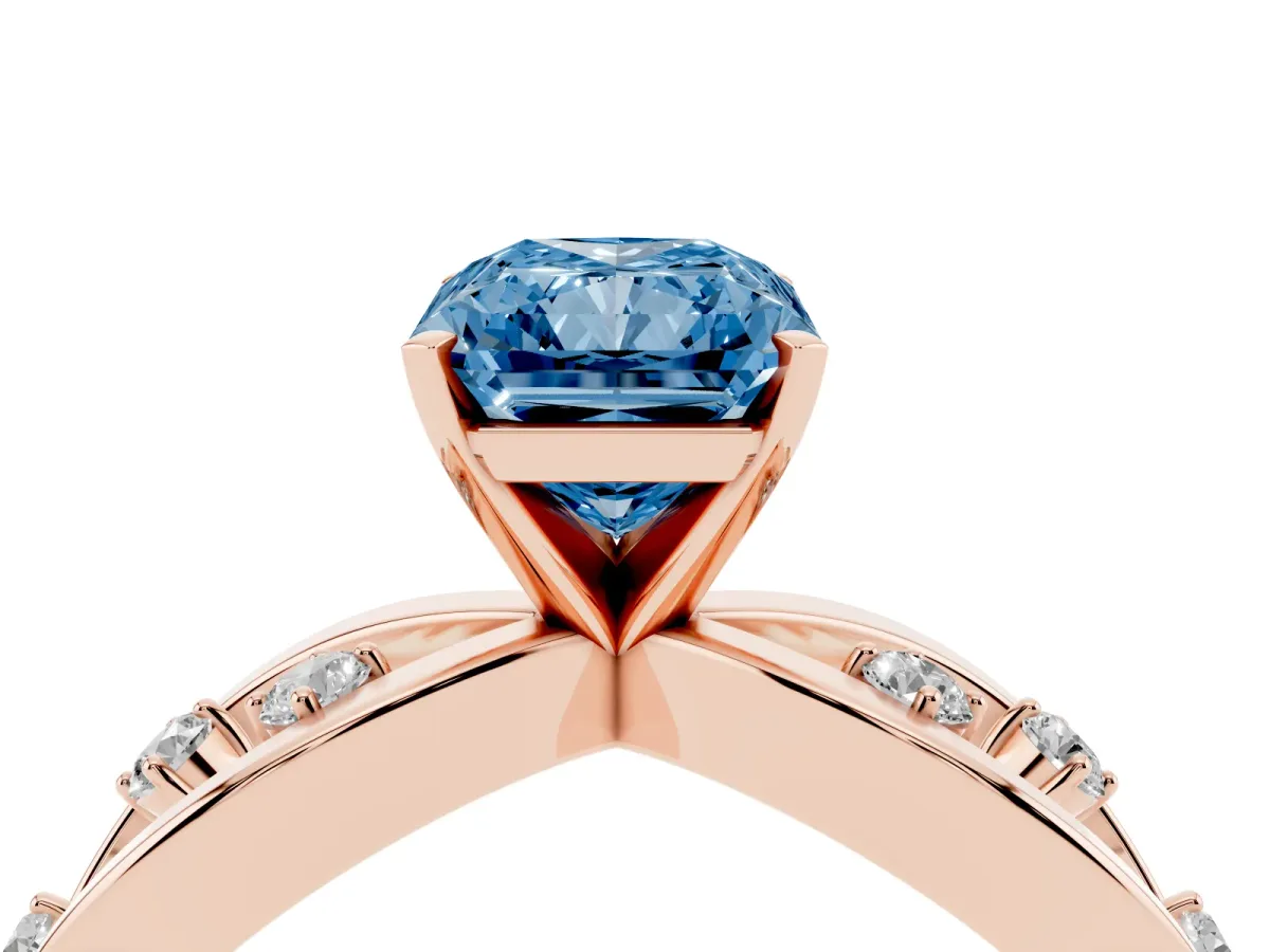 Fancy Blue Radiant Cut Cut Solitaire Diamond with Side Stones on Criss-Cross Band and Four-Prong Setting Rose gold