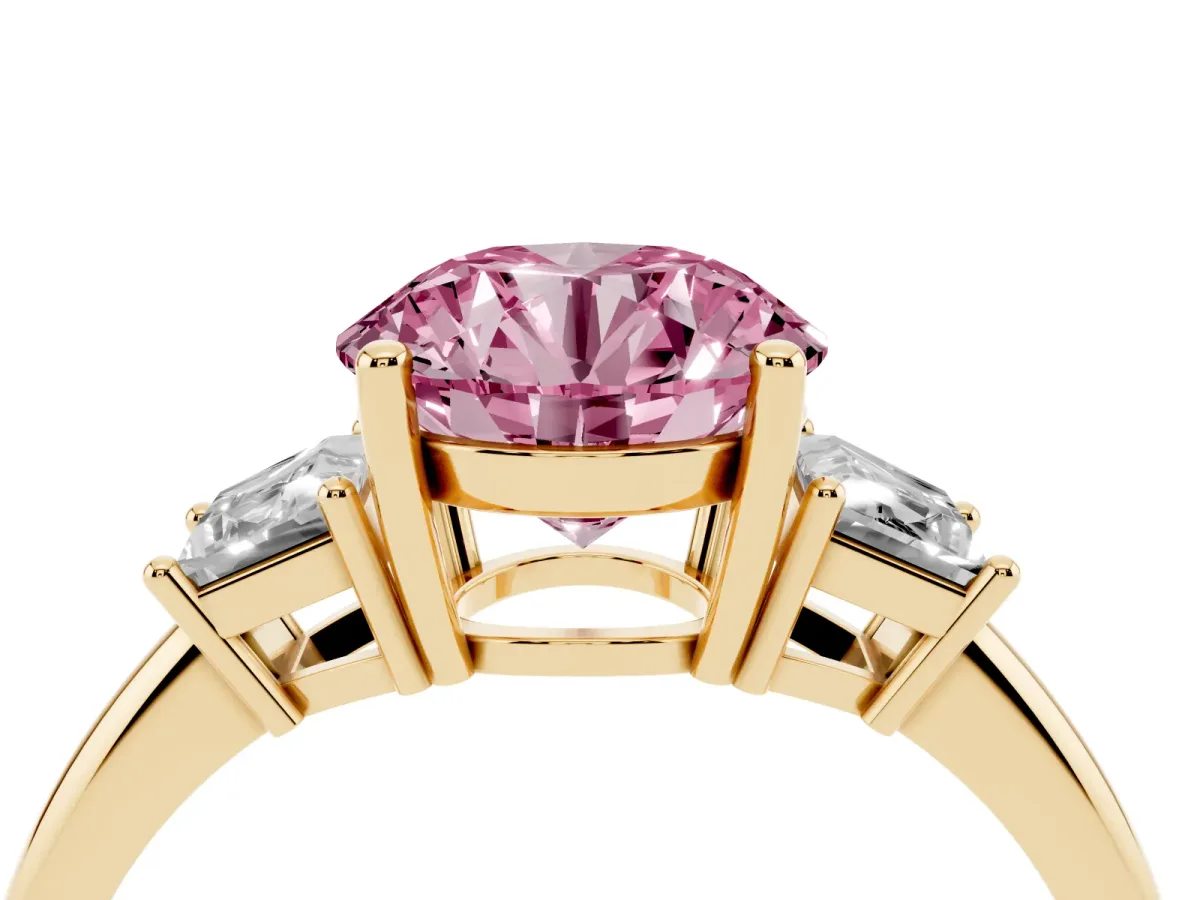 Fancy Pink Round Cut Diamond Three-Stone Ring with Trapezoid Side Stones and Prong Setting Yellow gold