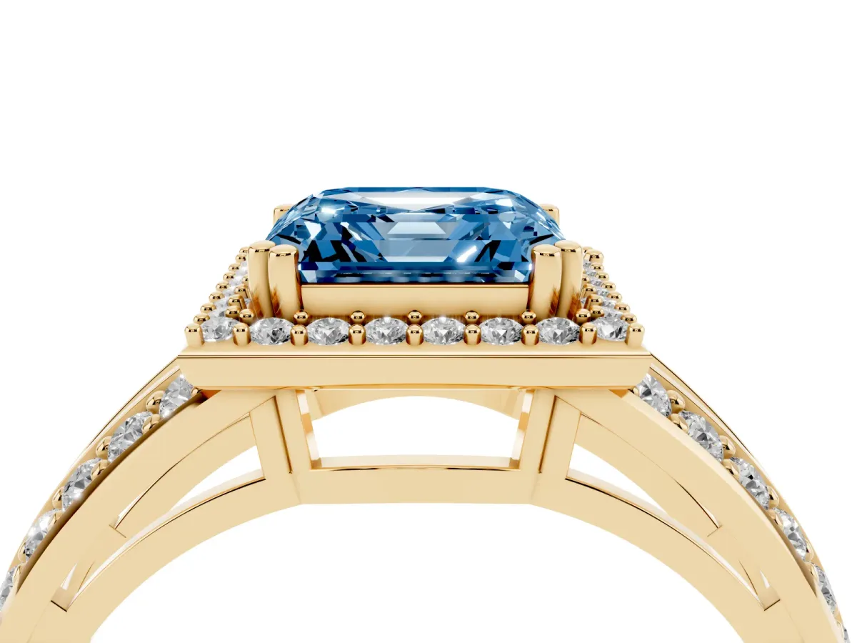 Fancy Blue Asscher Cut Diamond Halo Ring with Split Shank Pavé Band and Four-Prong Setting Yellow gold
