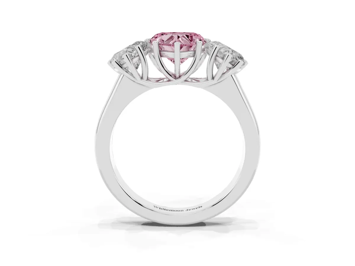 Fancy Pink Heart Cut Three-Stone Diamond Ring with Prong Setting on a Classic Band Silver