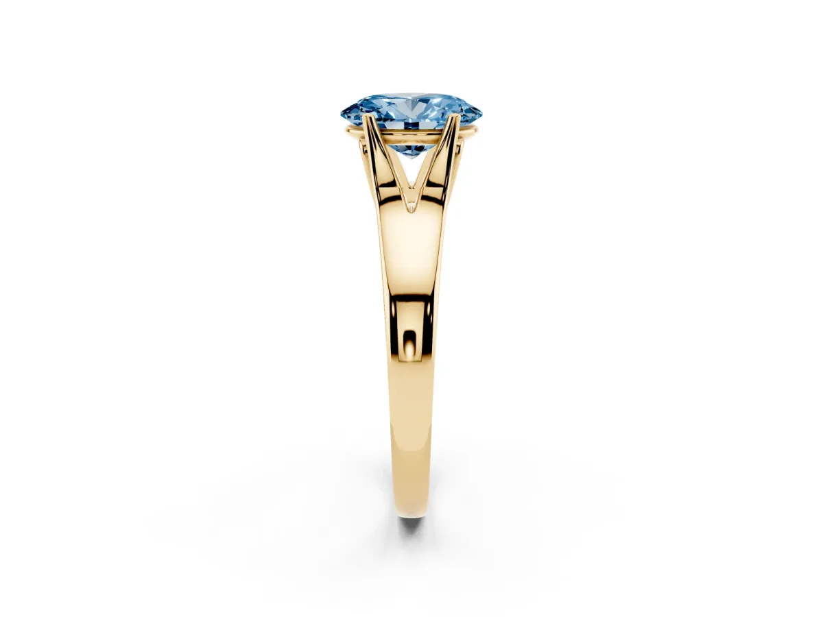 Fancy Blue Oval Cut Solitaire Diamond Ring with Cathedral Band and Four-Prong Setting Yellow gold