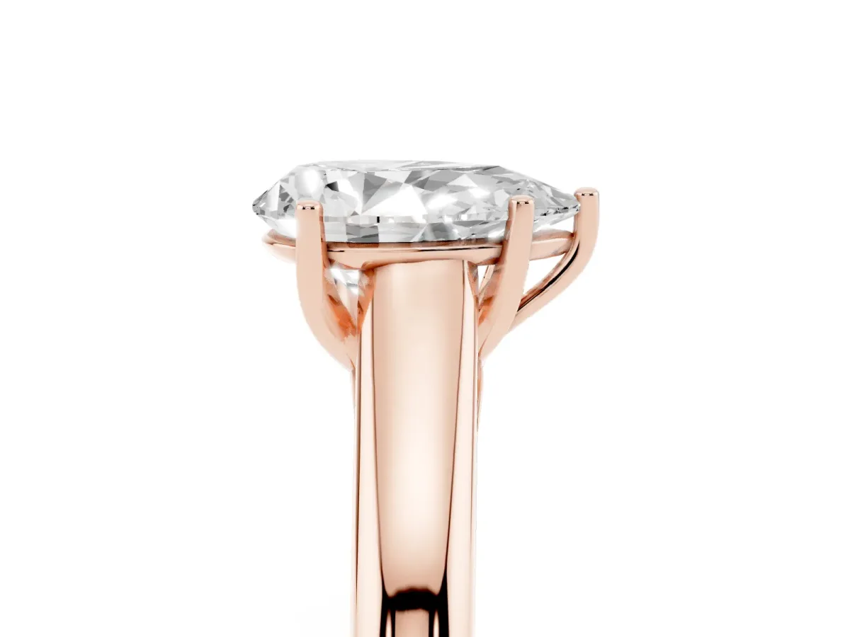 Pear Cut Solitaire Engagement Ring with Tapered Band and Four-Prong Setting Rose gold