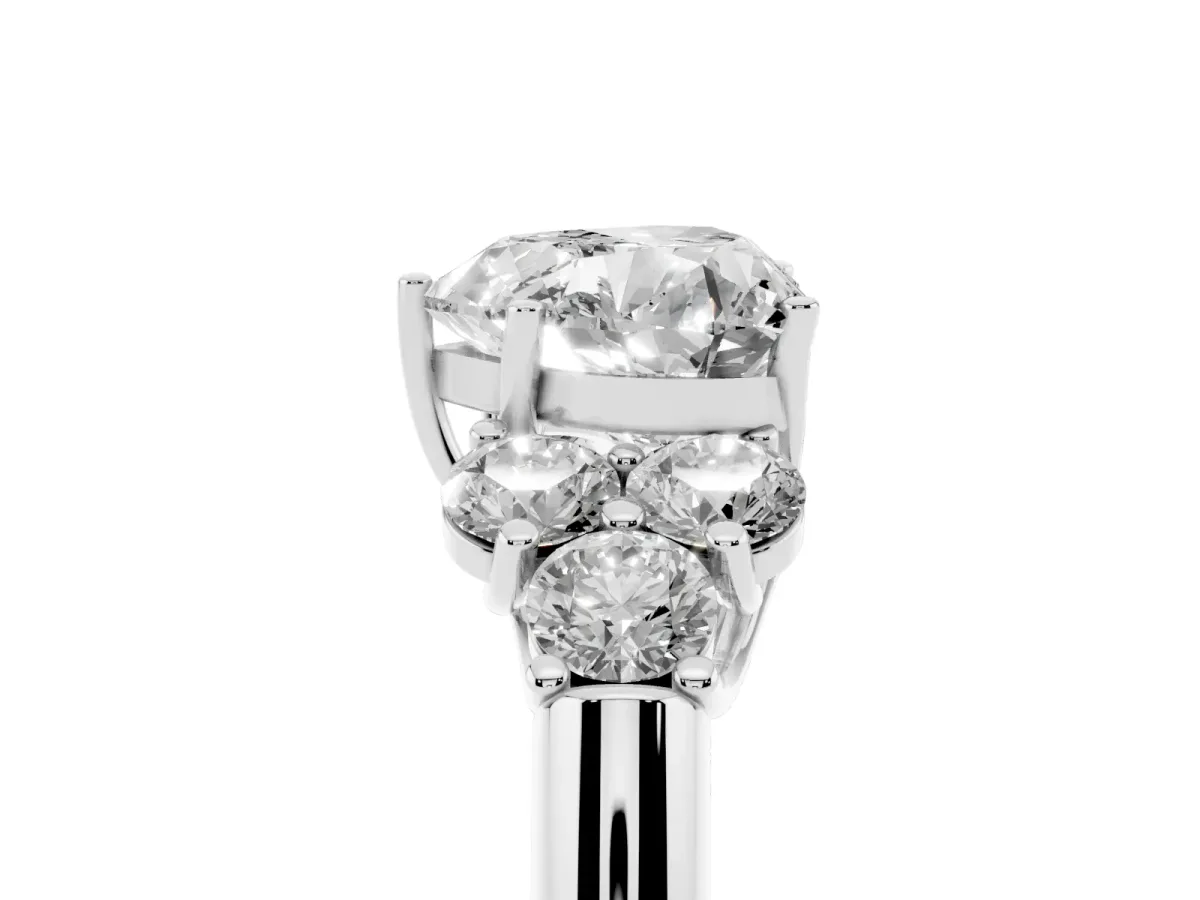 Heart Cut Cut Diamond Cluster Ring with Round Accent Stones and Prong Setting on a Classic Band White gold