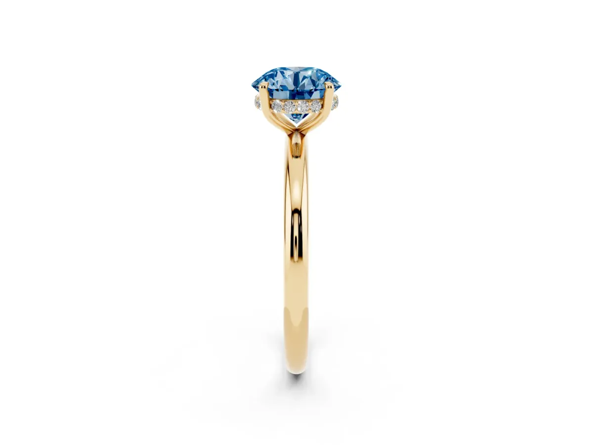 Fancy Blue Round Cut Diamond Solitaire Ring with Thin Band and Four-Prong Setting Yellow gold