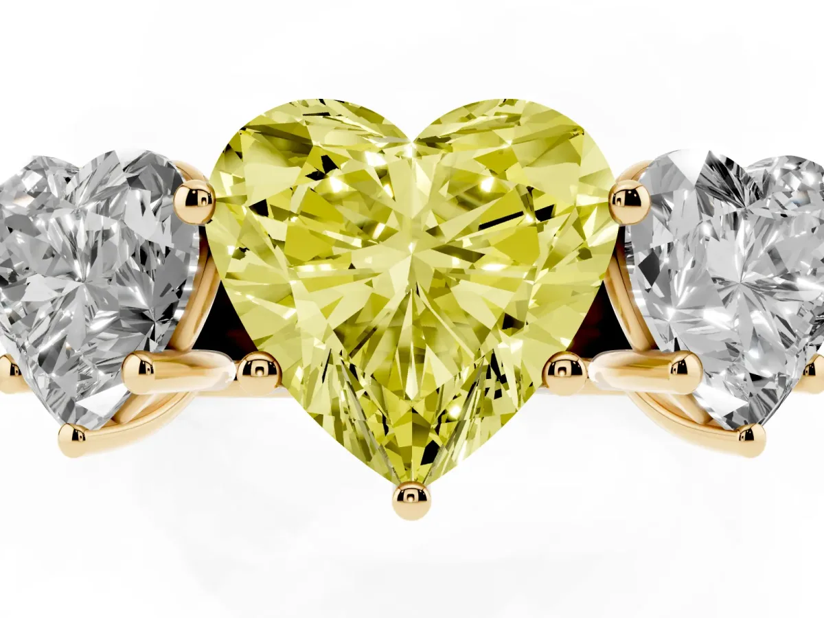 Fancy Yellow Heart Cut Three-Stone Diamond Ring with Prong Setting on a Classic Band Yellow gold
