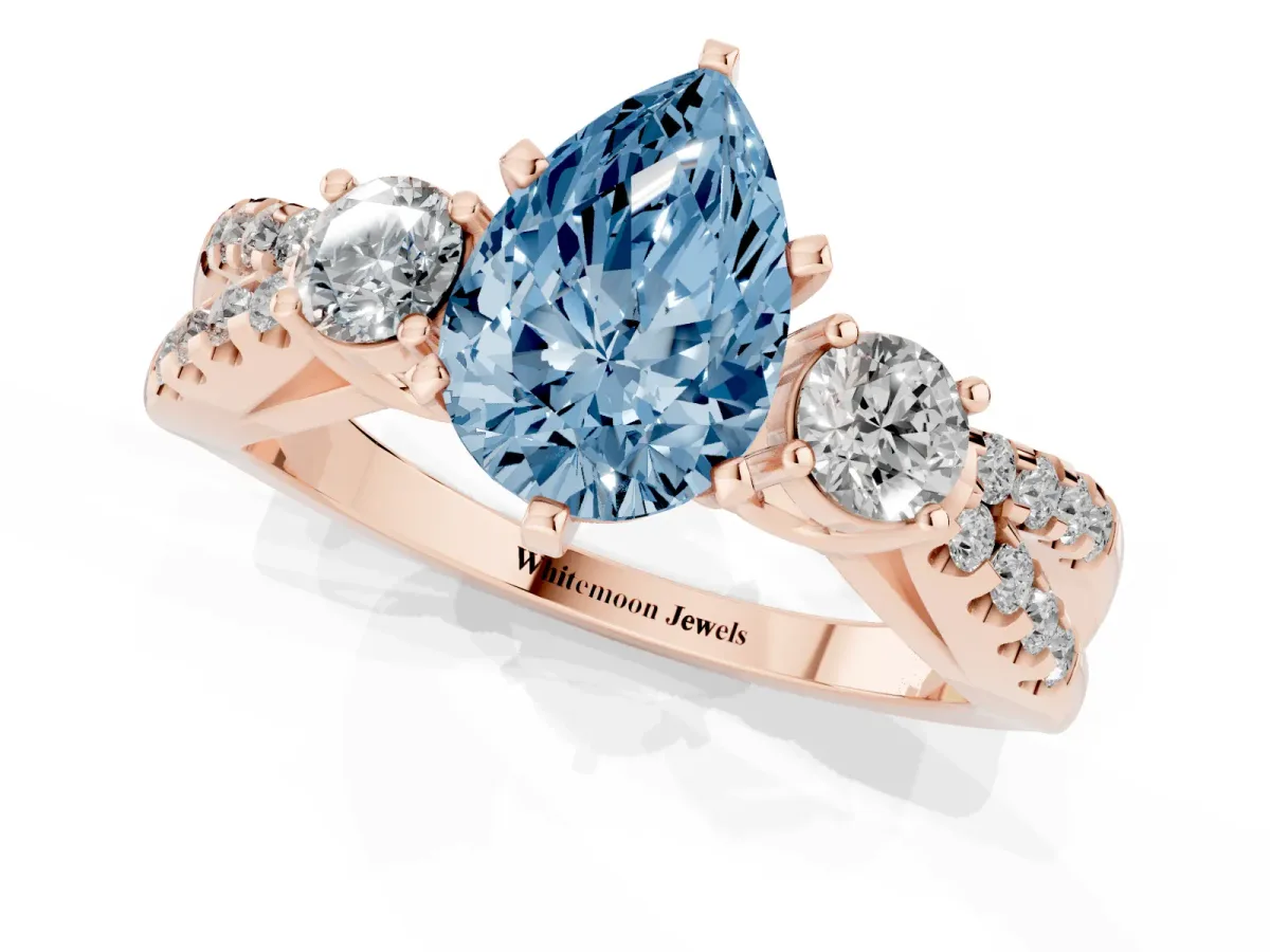 Fancy Blue Pear Cut Diamond Three-Stone Ring with Pavé Split Shank and Four-Prong Setting Rose gold