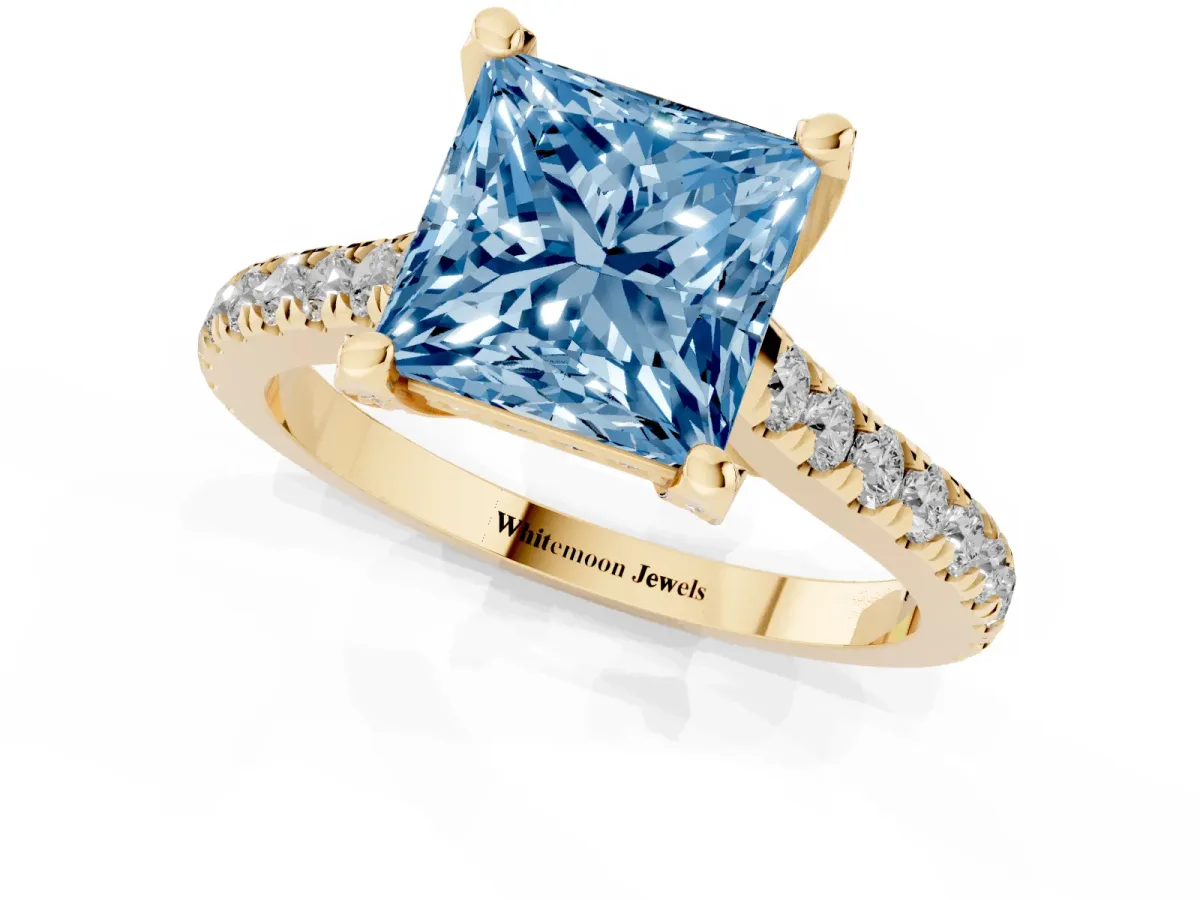 Fancy Blue Princess Cut Brilliant Diamond Solitaire with Pavé Band and Four-Prong Setting Yellow gold