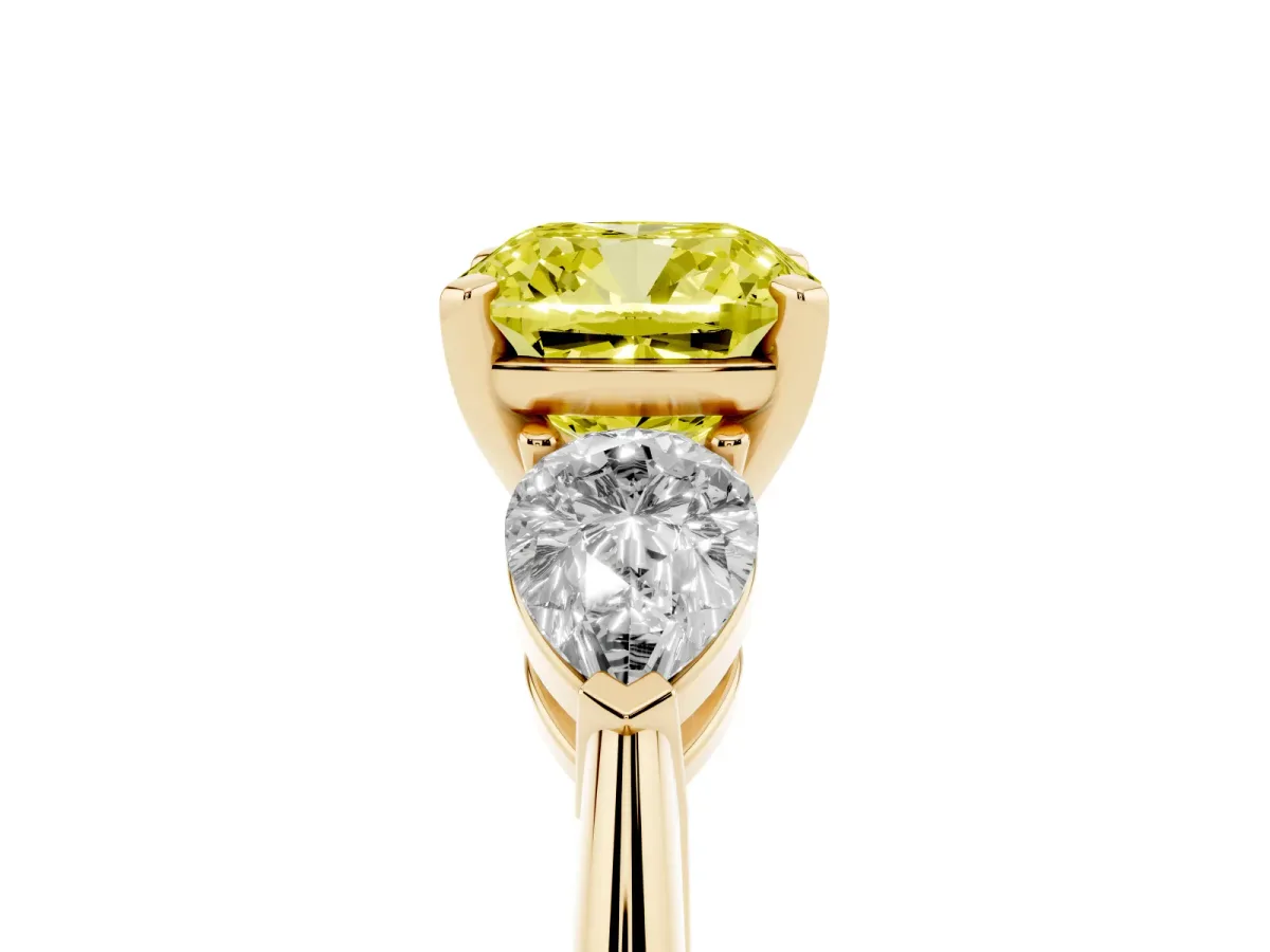 Fancy Yellow Three-Stone Cushion Cut Diamond Ring with Pear Side Stones and Four-Prong Setting Yellow gold