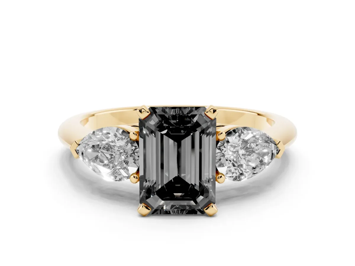 Fancy Black Three-Stone Emerald Cut Diamond Ring with Pear Side Stones and Four-Prong Setting Yellow gold