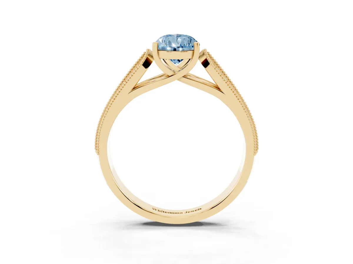 Fancy Blue Pear Cut Cut Pave Split Shank Engagement Ring with Four-Prong Setting Yellow gold