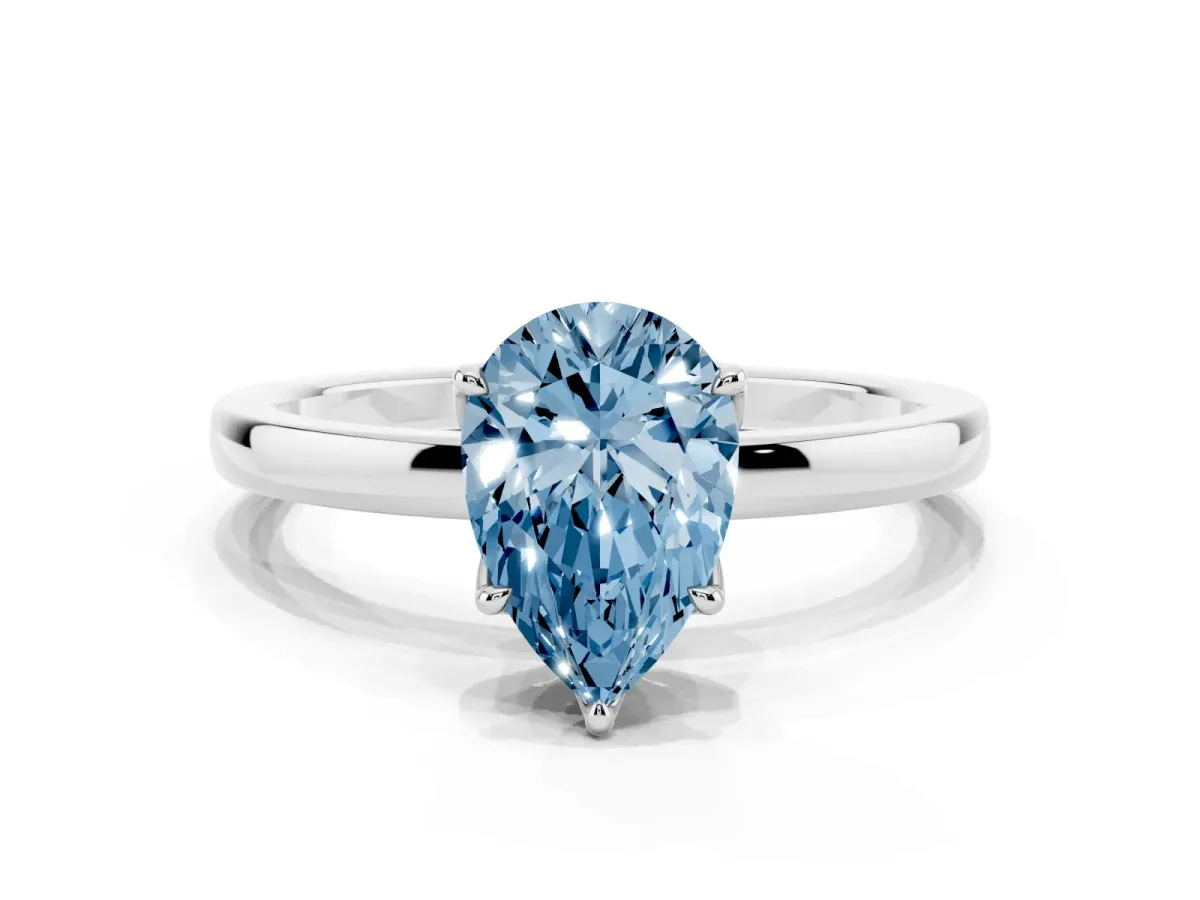 Fancy Blue Pear Cut Diamond Solitaire Ring with Thin Band and Prong Setting Silver