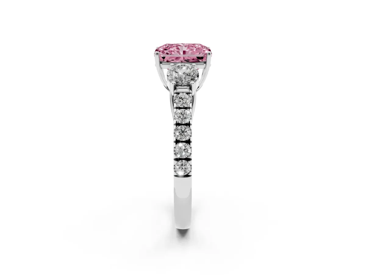 Fancy Pink Radiant Cut Cut Diamond Three-Stone Ring with Round Side Stones and Pavé Band Silver