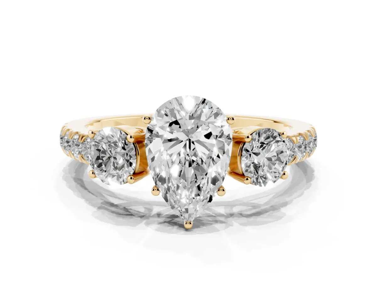 Pear Cut Cut Diamond Three-Stone Ring with Round Side Stones and Pavé Band Yellow gold