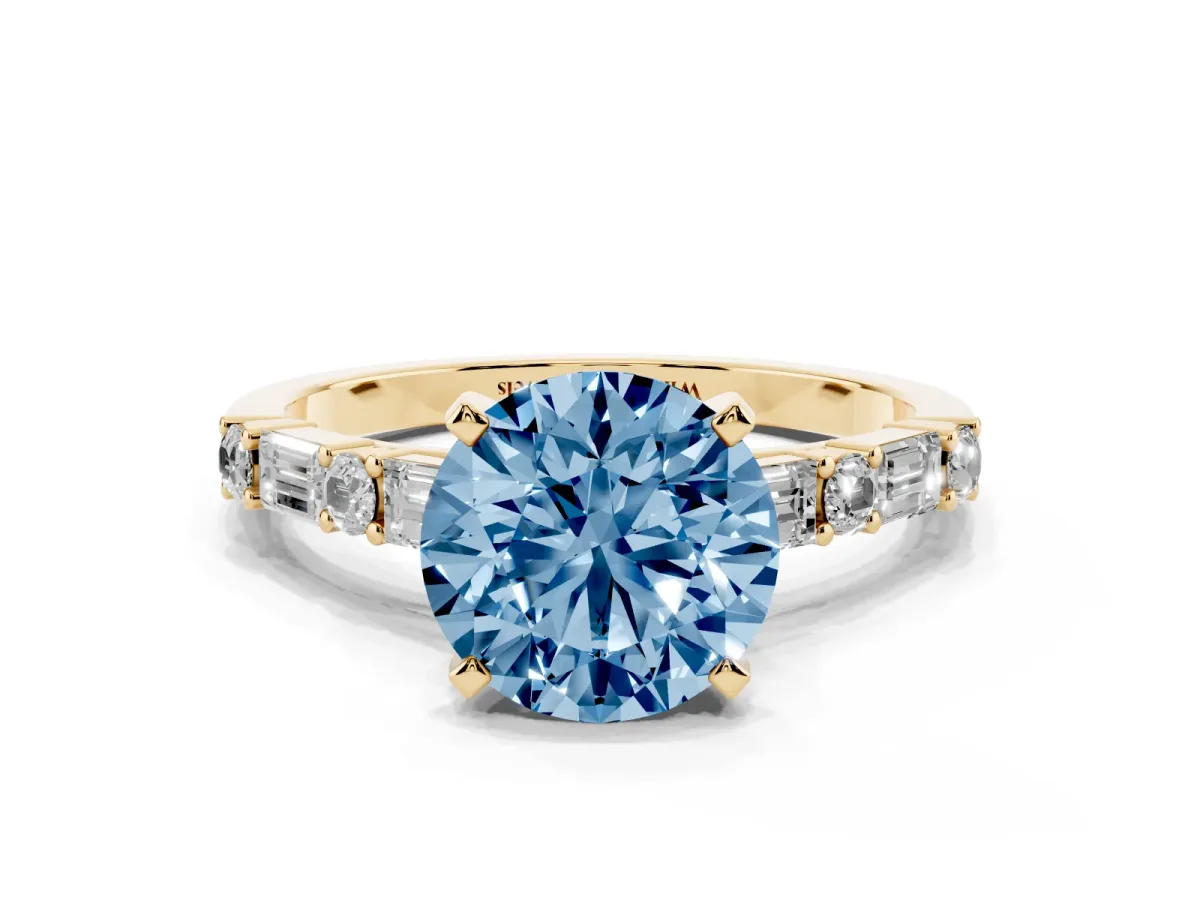 Fancy Blue Round Cut Diamond Solitaire with Side Baguettes and Channel Set Band Yellow gold
