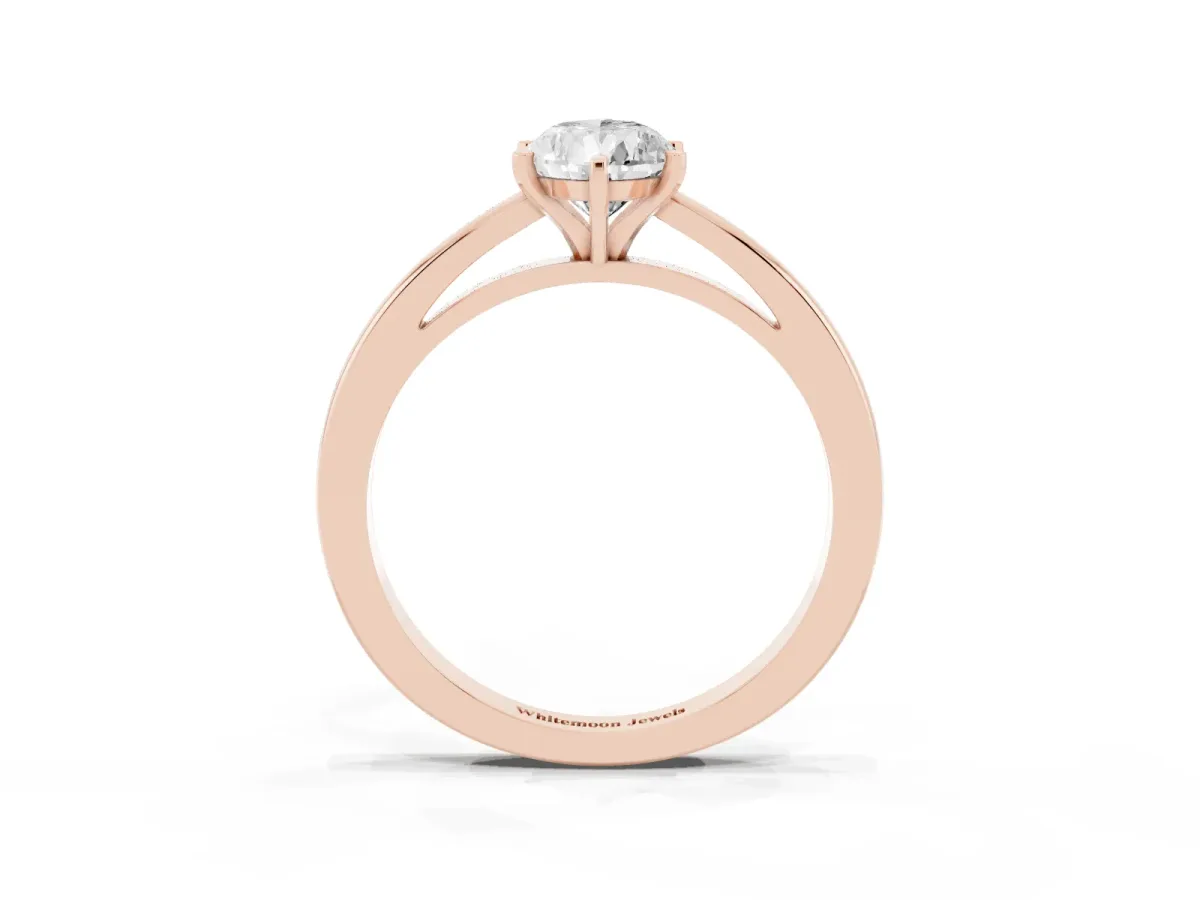 Pear Cut Solitaire Diamond Engagement Ring with Four-Prong Setting on a Classic Band Rose gold