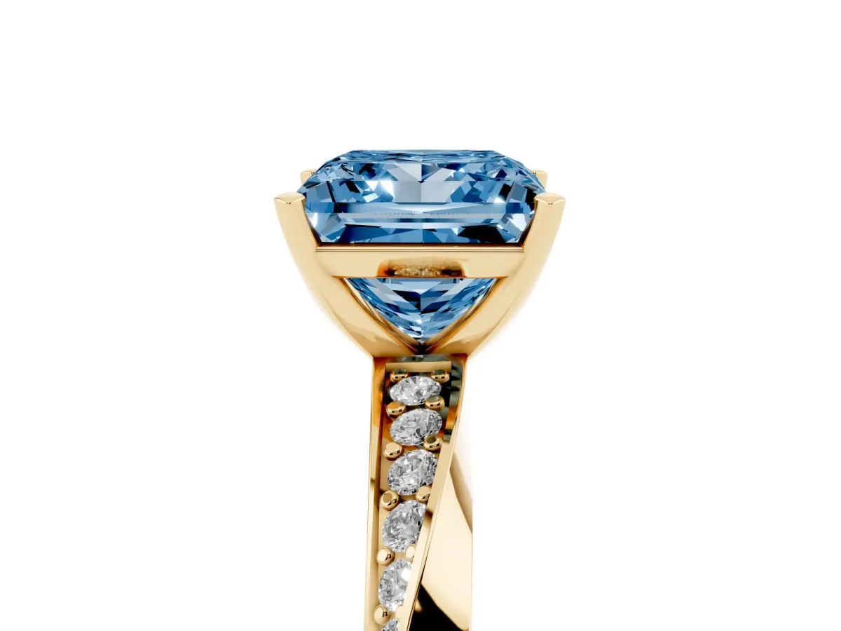 Fancy Blue Princess Cut Diamond Engagement Ring with Side Stone Accents and Four-Prong Setting Yellow gold