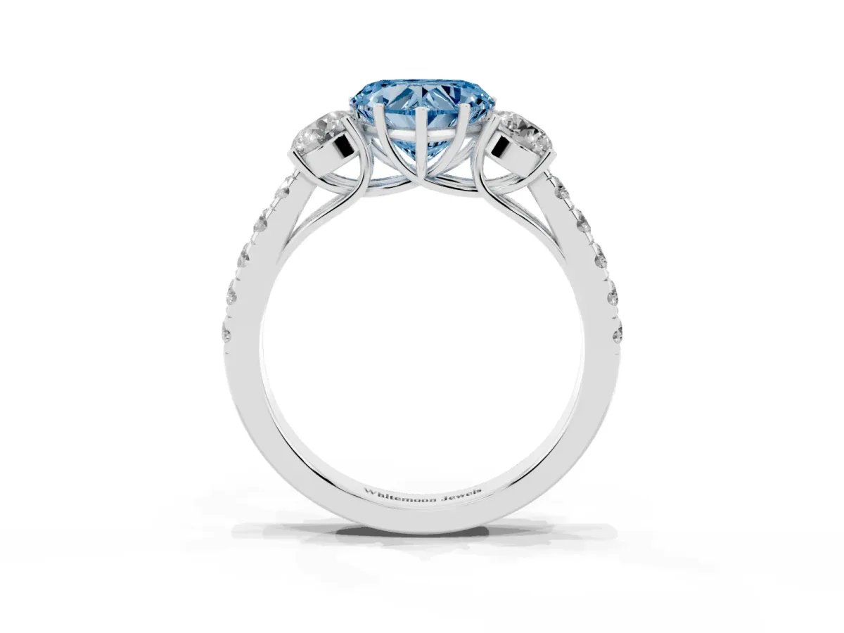 Fancy Blue Heart Cut Cut Diamond Three-Stone Ring with Round Side Stones and Pavé Band Platinum