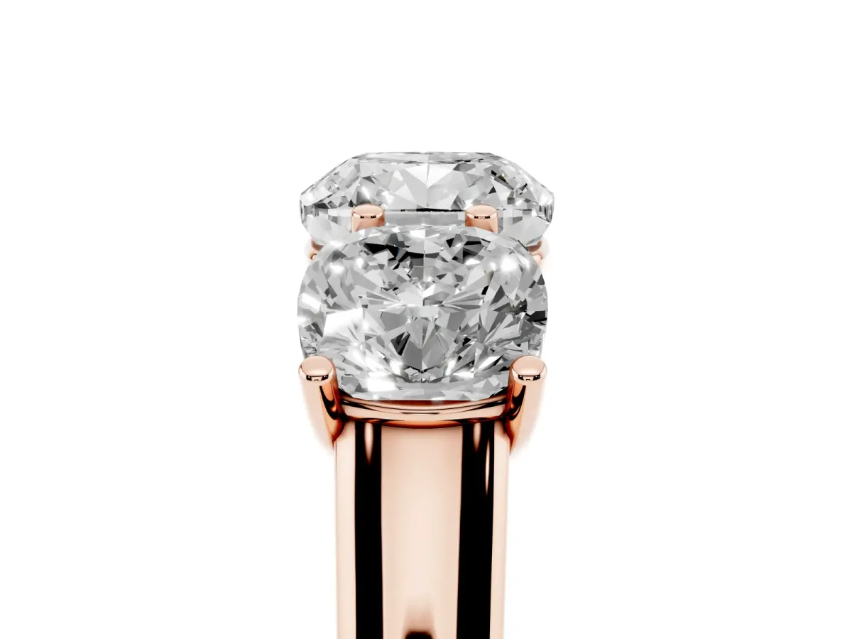 Cushion Cut Three-Stone Diamond Ring with Prong Setting on a Classic Band Rose gold