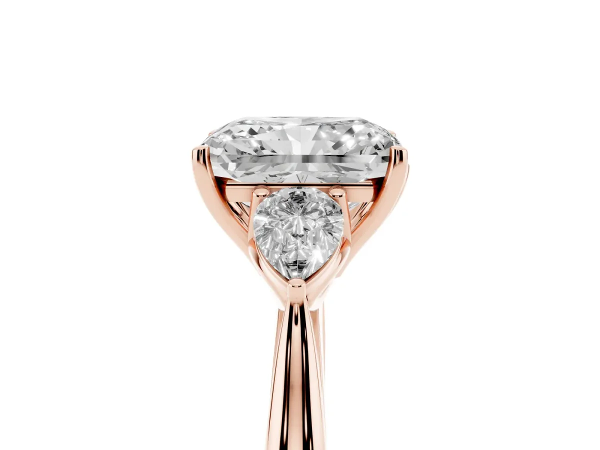 Radiant Cut Diamond Three-Stone Ring with Pear Side Stones and Prong Setting Rose gold