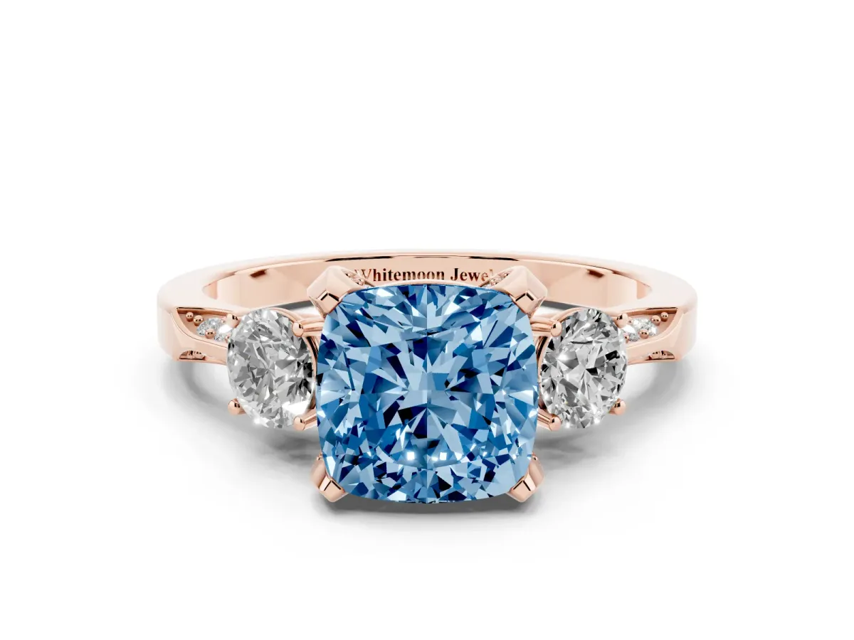 Fancy Blue Cushion Cut Brilliant Three-Stone Diamond Ring with Pavé Band and Four-Prong Setting Rose gold