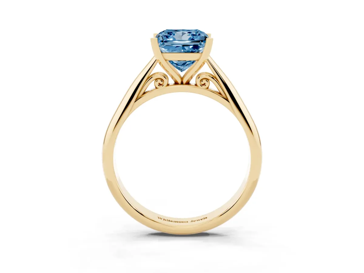 Fancy Blue Princess Cut Diamond Solitaire Engagement Ring with Cathedral Setting and Four-Prong Mount Yellow gold