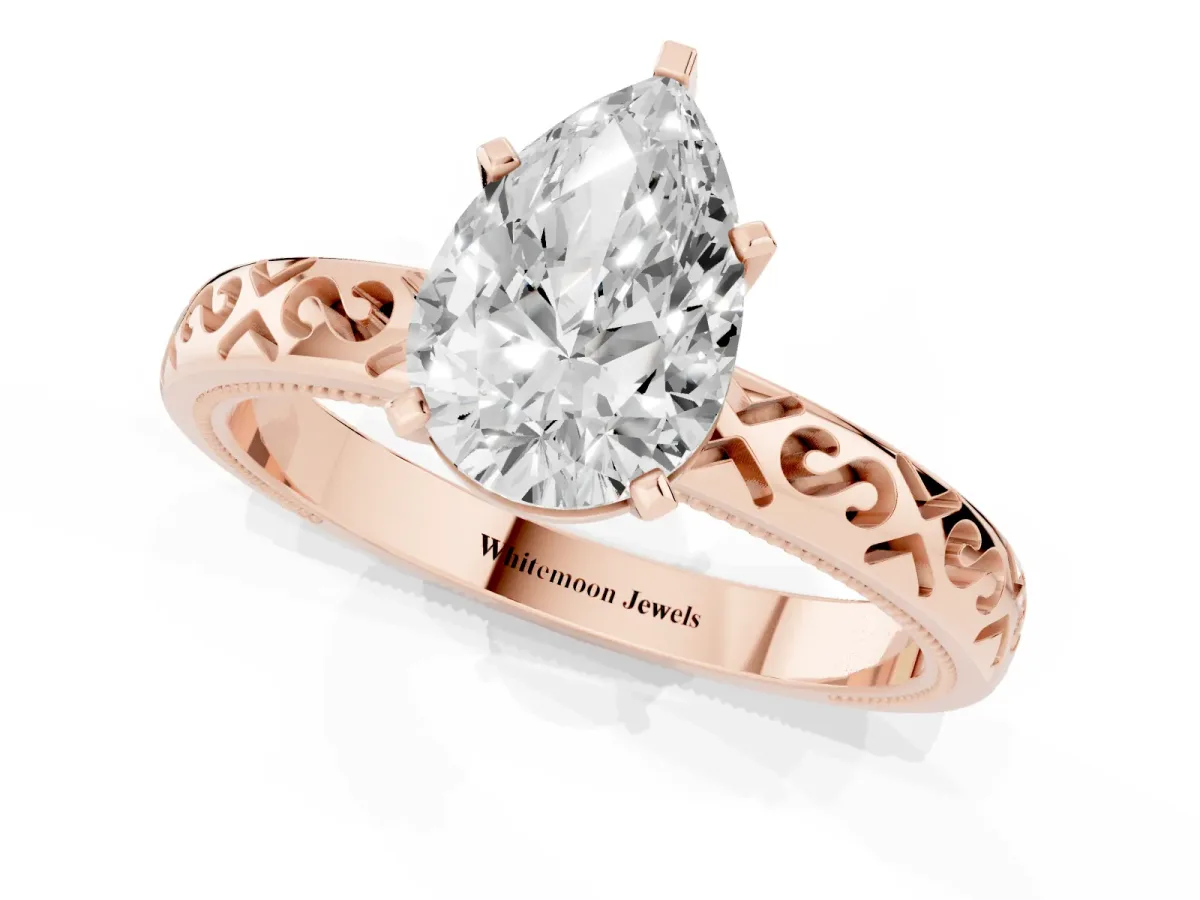 Pear Cut Solitaire Engagement Ring with Scrollwork Band and Four-Prong Setting Rose gold