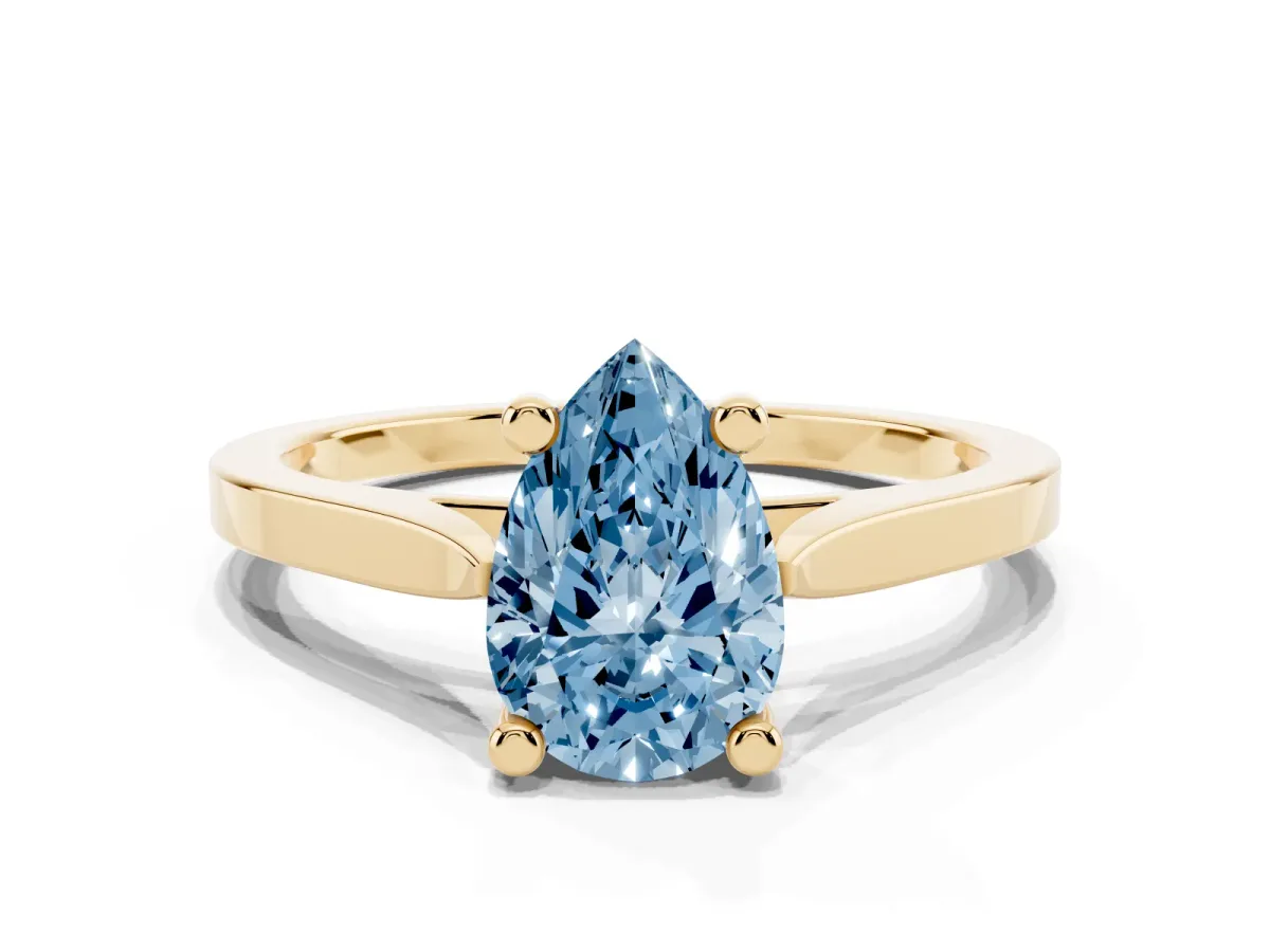 Fancy Blue Pear Cut Solitaire Diamond Ring with Four-Prong Setting and Tapered Band Yellow gold
