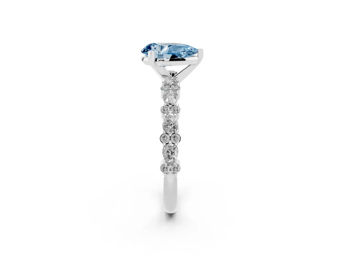 Fancy Blue Pear Cut Diamond Side Stone Solitaire Ring with Round and Four-Prong Setting White gold